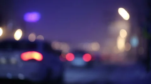 Traffic at snowy night producing nice big bokeh Stock Footage 61363497