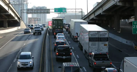 Traffic stop and crawl looking south I-35 lower deck downtown Austin traffic Stock Footage 146002612