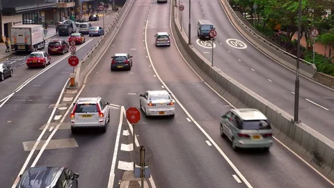 TRAFFIC AT STOP JUNCTION ON CENTRAL HONG KONG Stock Footage 76700331