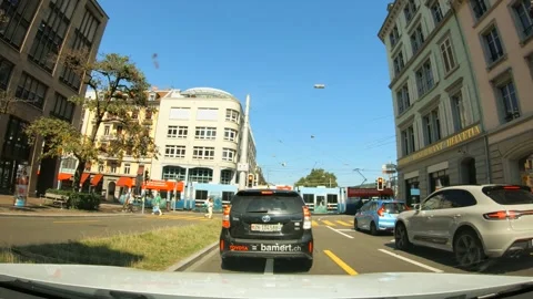 Traffic stops at intersection with tram &amp; pedestrian crosses, Zurich, Switerland Stock Footage 270869824