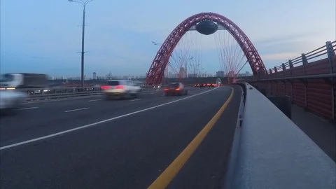 Traffic through cable-stayed bridge in summer evening timelapse Vidéo 79814606