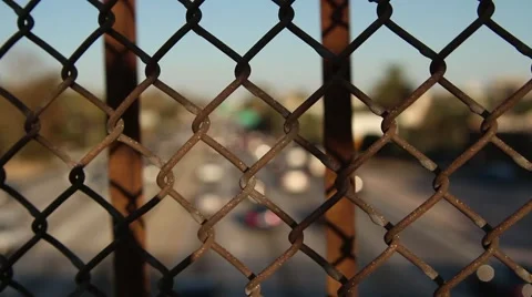 Traffic through a fence Stock-Footage 67639329