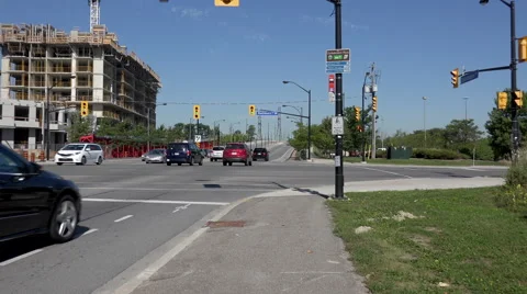 Traffic thru an intersection, proceeding to an overpass. Stock Footage 41258321