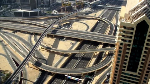 Traffic time lapse on major cross road in Dubai Stock Footage 104459133
