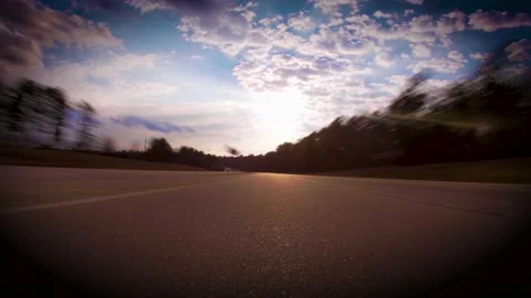 Traffic Time-lapse POV FPV low to the ground highway clouds and blue sky vign Stock Footage 152191714