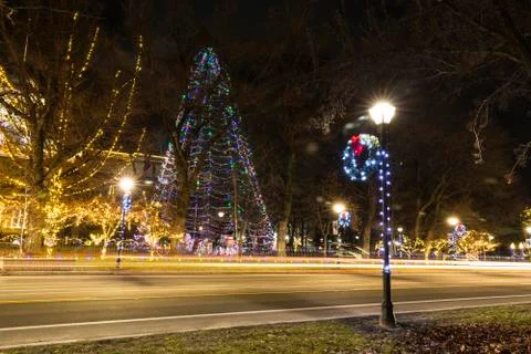 Traffic trails running down a Carson City street at night decorated with holi Stock Photos