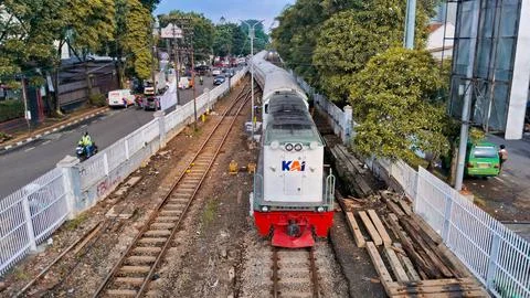 Traffic with train passed on the side of the highway,CC 201 Locomotive Stock Photos
