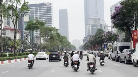 Traffic On A Tree Lined Street In Hanoi Vietnam Stock Footage 334869033