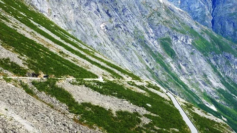 Traffic on Trollstigen or Trolls Path, a popular serpentine mountain road. Stock Footage 118159375