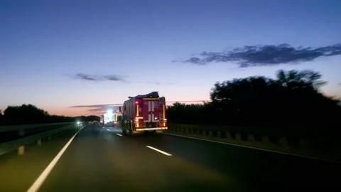 Traffic on a two-lane highway fire crew Stock Footage 205050025