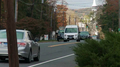 Traffic on two-lane road in town (2 of 3) Stock Footage 33302963