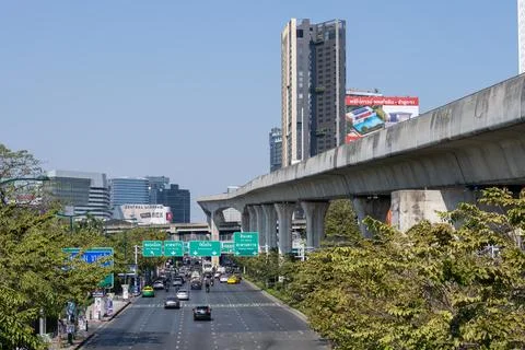 Traffic under elevated rail line in Bangkok Stock Photos