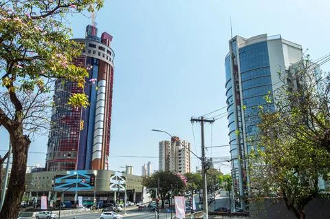 Traffic of vehicles and commercial buildings on Avenida do Contorno in the city Stock Photos
