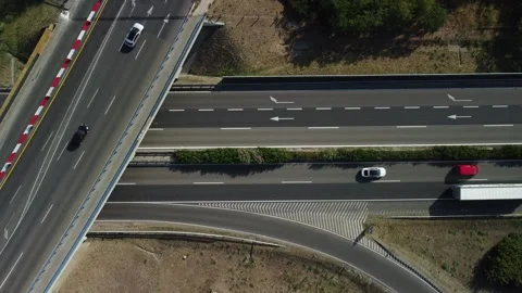 Traffic view of roads and vehicles at highway junction in a rural area during da Stock Footage 335333812
