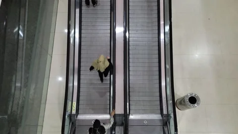 Traffic visitors who are using travelator from top view in normal speed, 4K Video stock 241877622