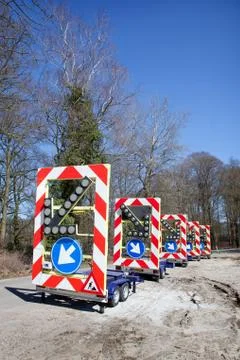 Traffic warning signs on wheels Stock Photos