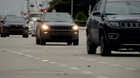 Traffic Westbound on Sample Road Railroad Tracks Stock Footage 200798604