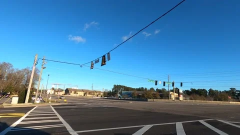 Traffic on Wheeler road at Robert C Daniel parkway on a clear sunny day with  Stock Footage 152171779