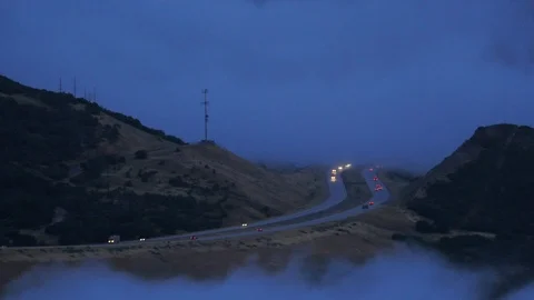 Traffic in a window of fog.  Stock Footage 96371023