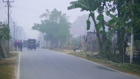 Trafic moving on the road at morning time in village area Stock Footage 206019403