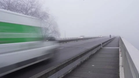 Trafic trough fog slow shutter Video stock 163557292