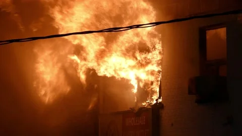 A tragic event of raging fire burning down buildings and lives and caused Stock Footage 157299378