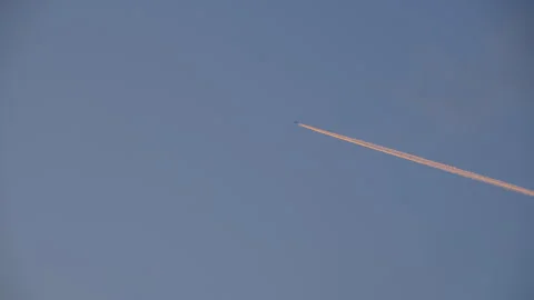 Trail of airplane on blue sky Stock Footage 250200059