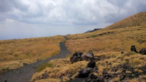 Trail and clouds Stock Photos