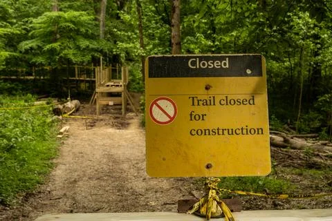Trail Closed Sign With Bridge Under Construction In The Background Stock Photos