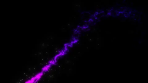 A trail of colored particles writing out figures on a black background 3 Stock Footage 302811974