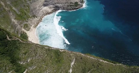 Trail Down Mountain to Prestine Bali Beach TRex Drone Shot Stock Footage 106788641
