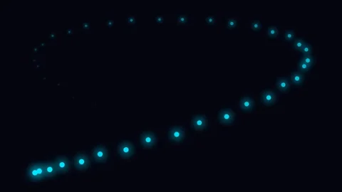 A trail of glowing blue particles forming a soft spiral on black background Video stock 335118055