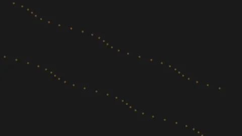 A trail of glowing fireflies lighting the night sky 库存影片 335255930