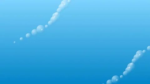 A trail of glowing white air bubbles rising upward in deep blue water 库存影片 335117730