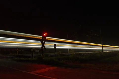 Trail of light from a train at night Stock Photos