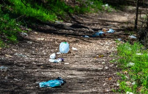 Trail with litter: plastic cups, packaging, plastic bag, bottle, Colorado B.. Stock Photos
