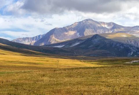 A trail on a mountain plateau located on the path of a tourist route with an Stock Photos