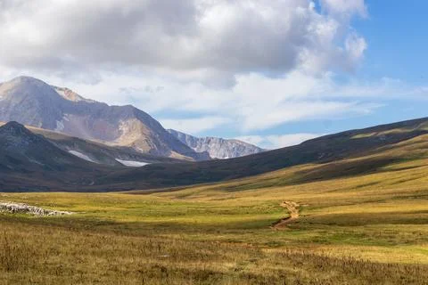 A trail on a mountain plateau located on the path of a tourist route with an Stock Photos