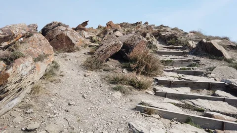 Trail of the mountain through the rocks Video stock 129790556