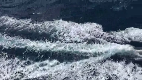 Trail of ocean wave behind a speedboat 4K Stock Footage 69206635