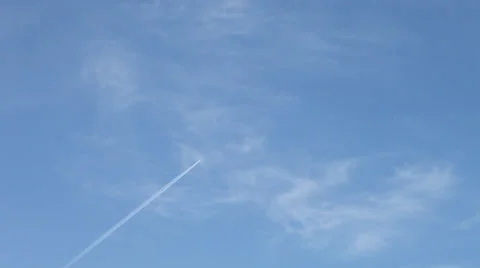 Trail of plane high in sky Stock Footage 37437452