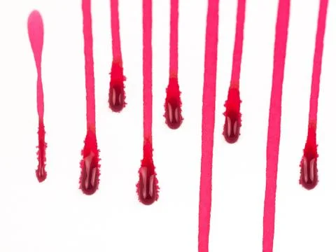 Trail of Red paint dripped down on white background, blood and danger concept Stock Photos