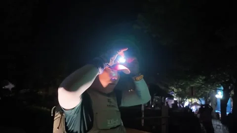 Trail Runner Adjusting Bright Headlamp in the Dark, Lushan Race Stock Footage 346701529