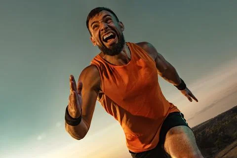 Trail Runner concept. Athlete sprinter run. Strong athletic man running on Stock Photos