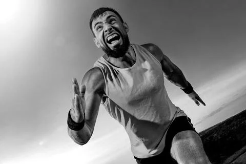 Trail Runner concept. Athlete sprinter run. Strong athletic man running on Stock Photos