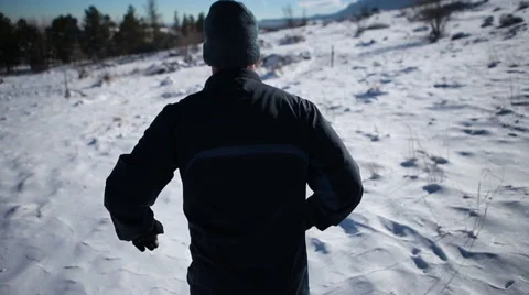 Trail runner running snow mountain path Stock-Footage 50960048