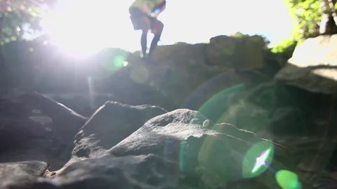 Trail runner runs down rocky section. Stock-Footage 138863981