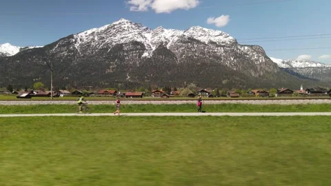 Trail runners and cyclists in a mountain race at Garmisch-Partenkirchen Stock Footage 338036646