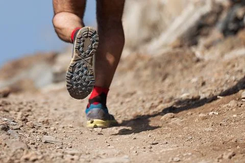 Trail running action close up of running shoes Stock Photos