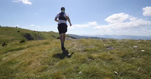 Trail running athlete running on the mountain ridge fast. Endurance and competit Stock Footage 139986604